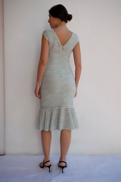 Mint wave-texture midi cocktail dress with ruffle hem and elegant neckline detail back view.