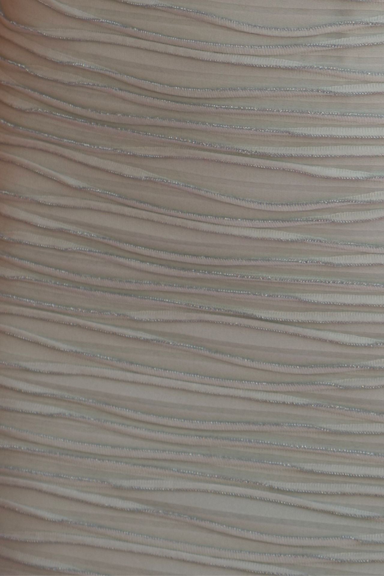 Mint wave-texture fabric detail.