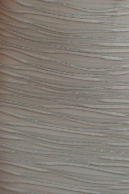 Mint wave-texture fabric detail.