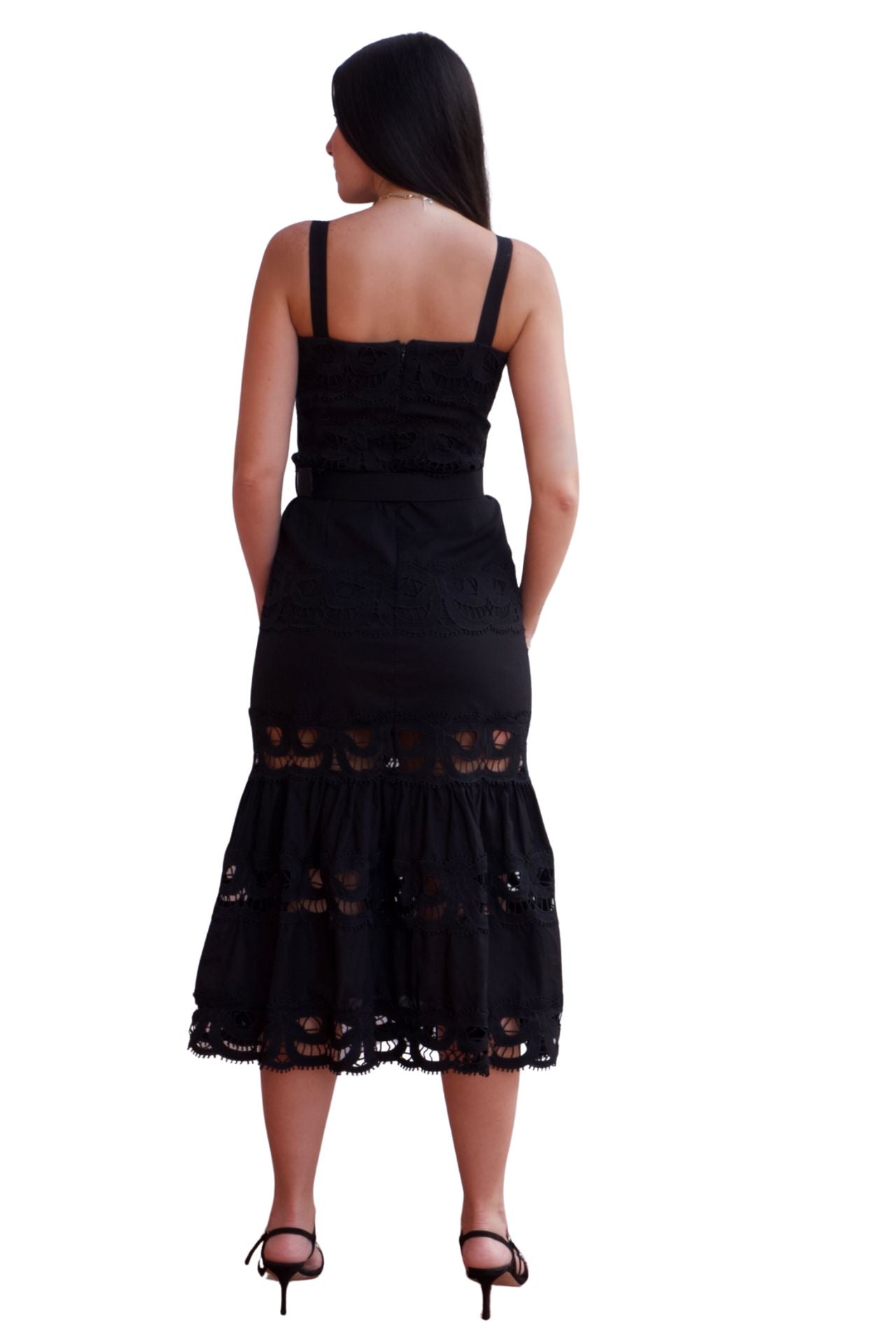 Woman wearing a lace detail belted maxi dress with ruffle hem in black and white.
