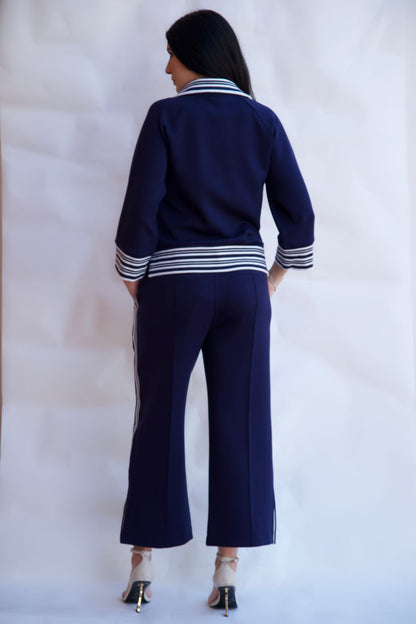 Navy striped zip up travel set with wide leg pants styled with heels available online and in-store