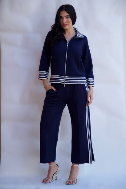 Navy striped zip up travel set with wide leg pants styled with heels available online and in-store