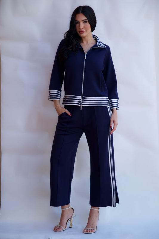 Navy striped zip up travel set with wide leg pants styled with heels available online and in-store