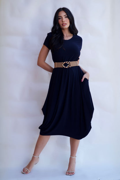 Navy wrinkle free travel midi dress styled with belt and heels available online and in-store