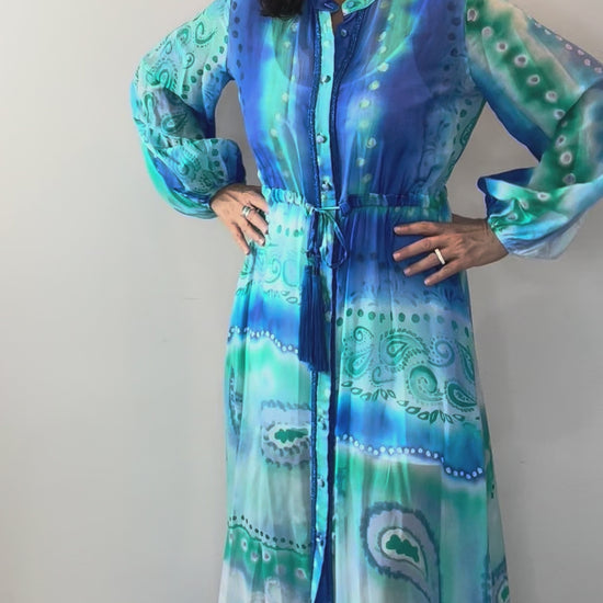 Model wearing Ocean Glen Button Front Maxi Dress with flowing silhouette and button front detail.