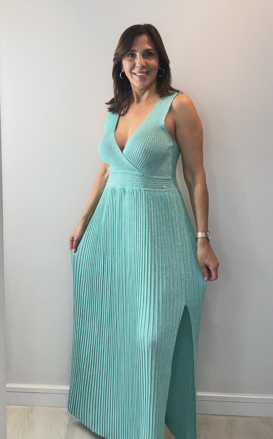 Model wearing Mint Shimmer Knit Midi Dress with elegant draping and subtle shimmer detail.