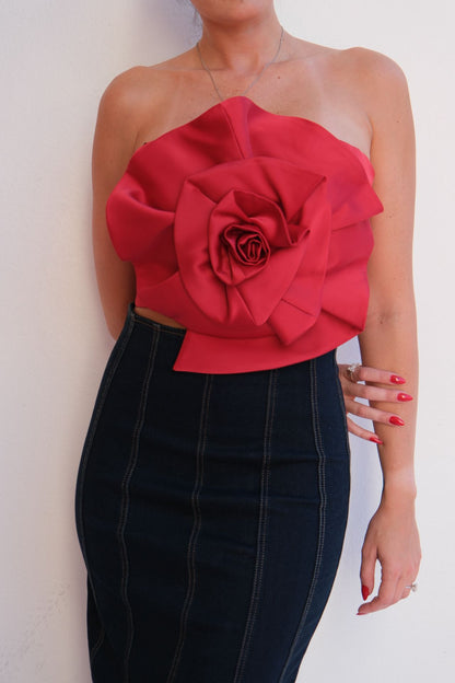 Red floral top worn by a woman