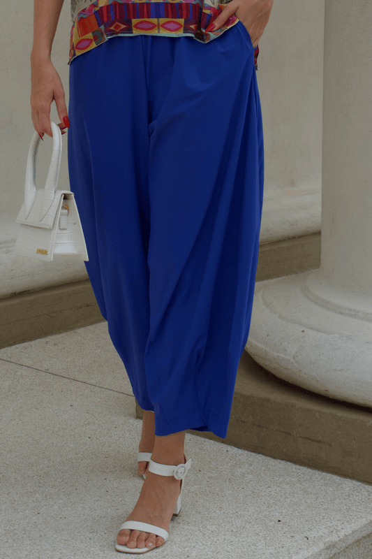 Closeup of a baggy royal blue pants.