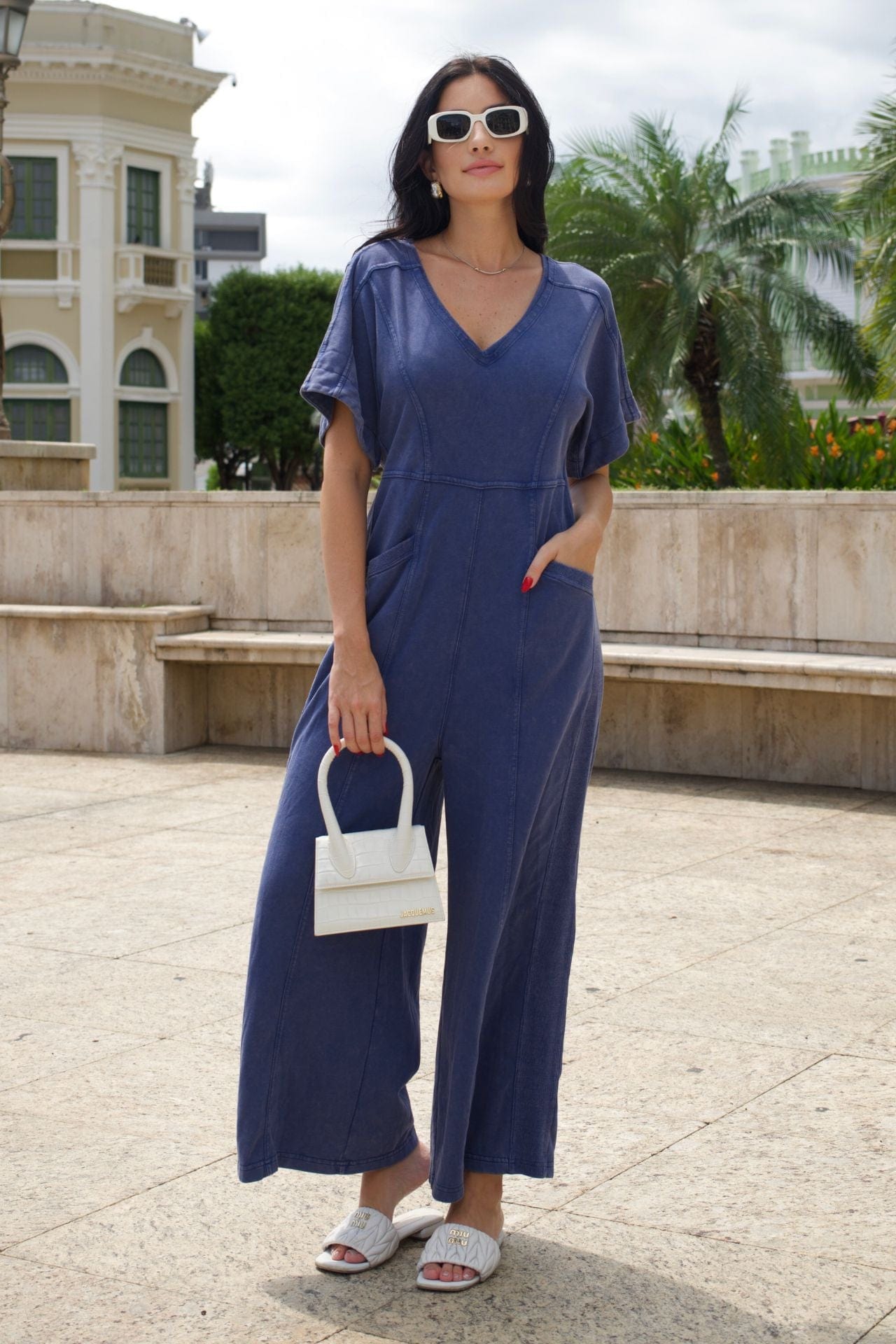Short sleeve blue mineral-wash jumpsuit.