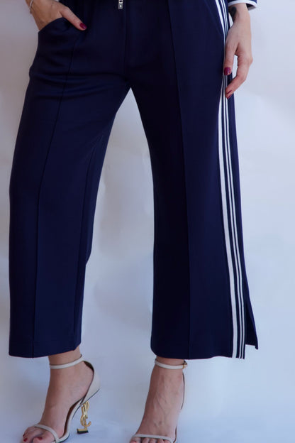 Navy striped wide leg pants styled with heels available online and in-store
