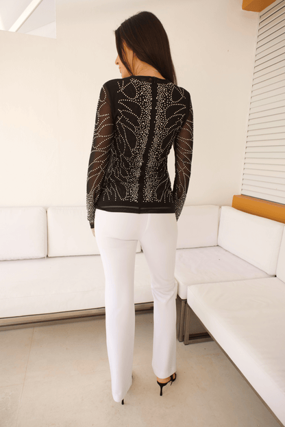 Woman wearing wide-leg dressy pants.