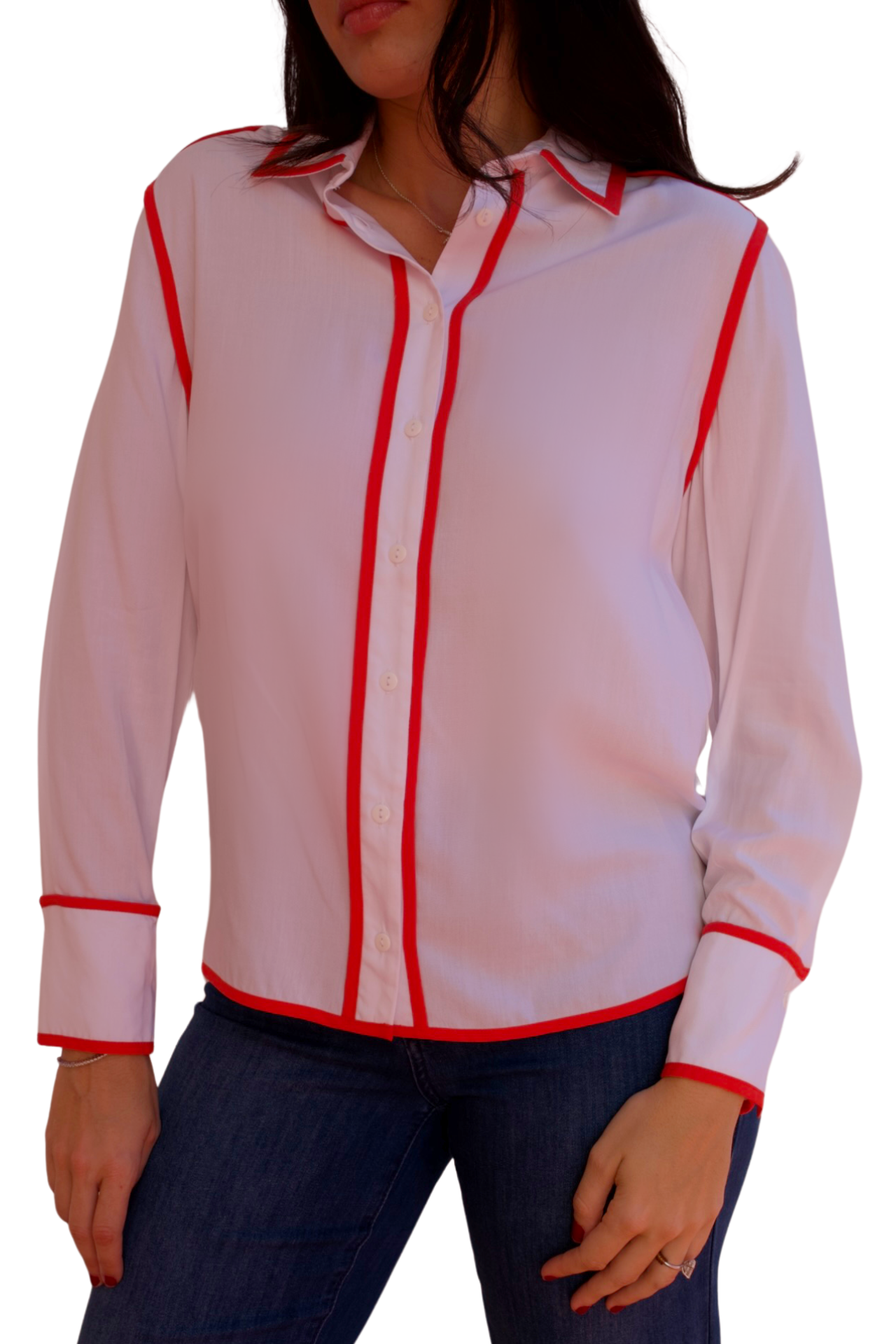 Model wearing a white long sleeve blouse with tangerine trim detail and button-front design.