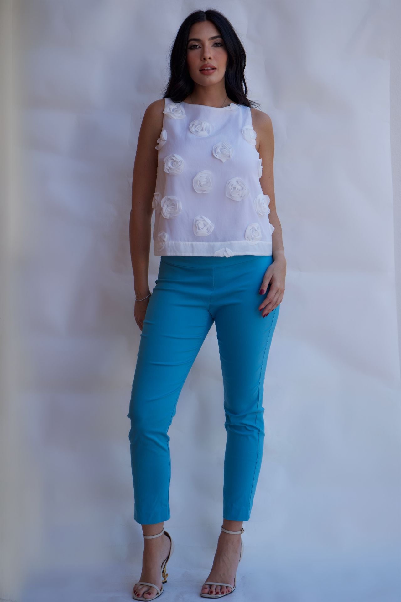 lifestyle look white rosette blouse styled with denim jeans chic spring outfit available online and in-store
