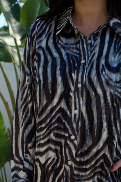 Zebra print satin long-sleeve maxi dress with gold accents — runs large, Elegance Boutique